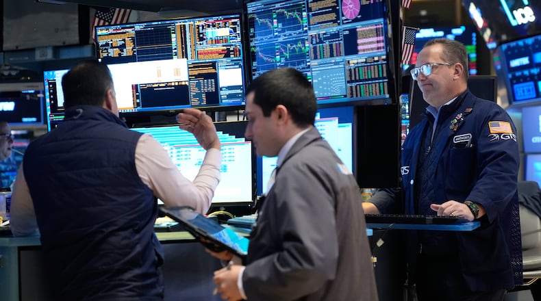 Traders work on the floor at the New York Stock Exchange in New York, Thursday, March 19, 2026. (AP Photo/Seth Wenig)