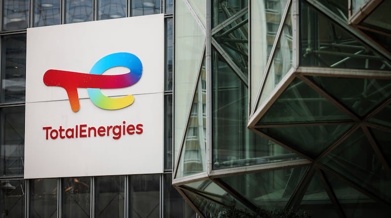 FILE - A sign for the French company TotalEnergies is displayed at headquarters March 21, 2025, in La Defense business district outside of Paris. (AP Photo/Thomas Padilla, File)