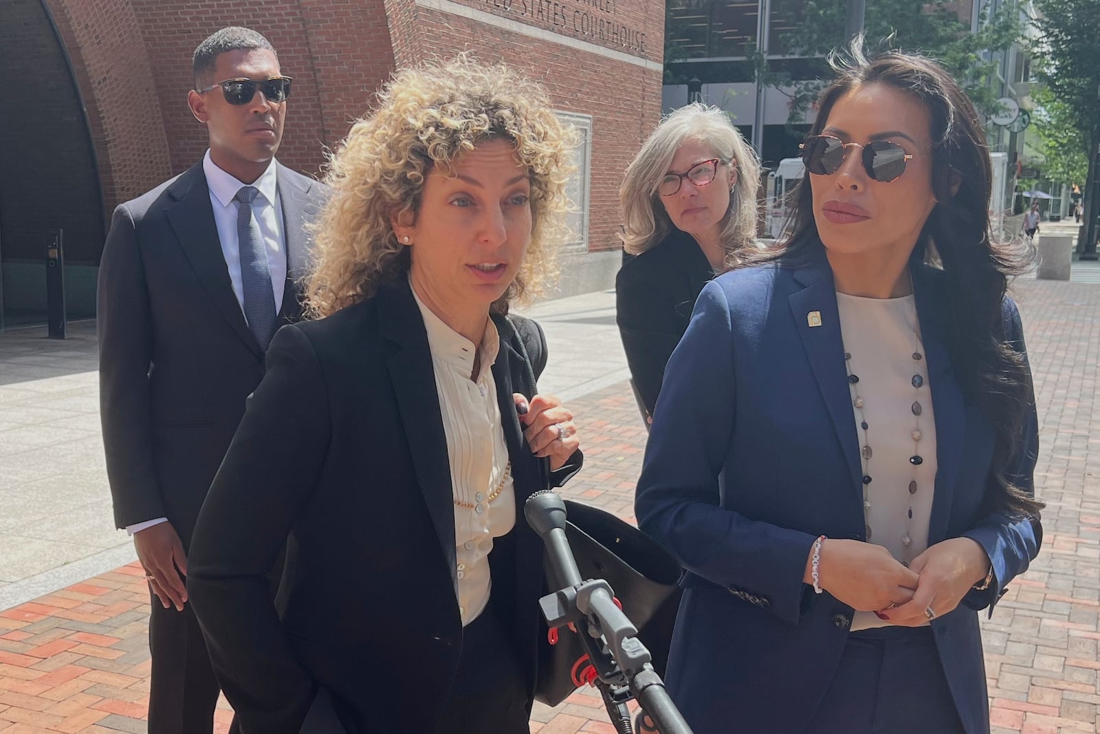 Planned Parenthood League of Massachusetts President and CEO Dominique Lee, right, and attorney, Emily Nestler, respond to questions after a federal court hearing in Boston on Friday, July 18, 2025. (AP Photo/Kimberlee Kruesi)
