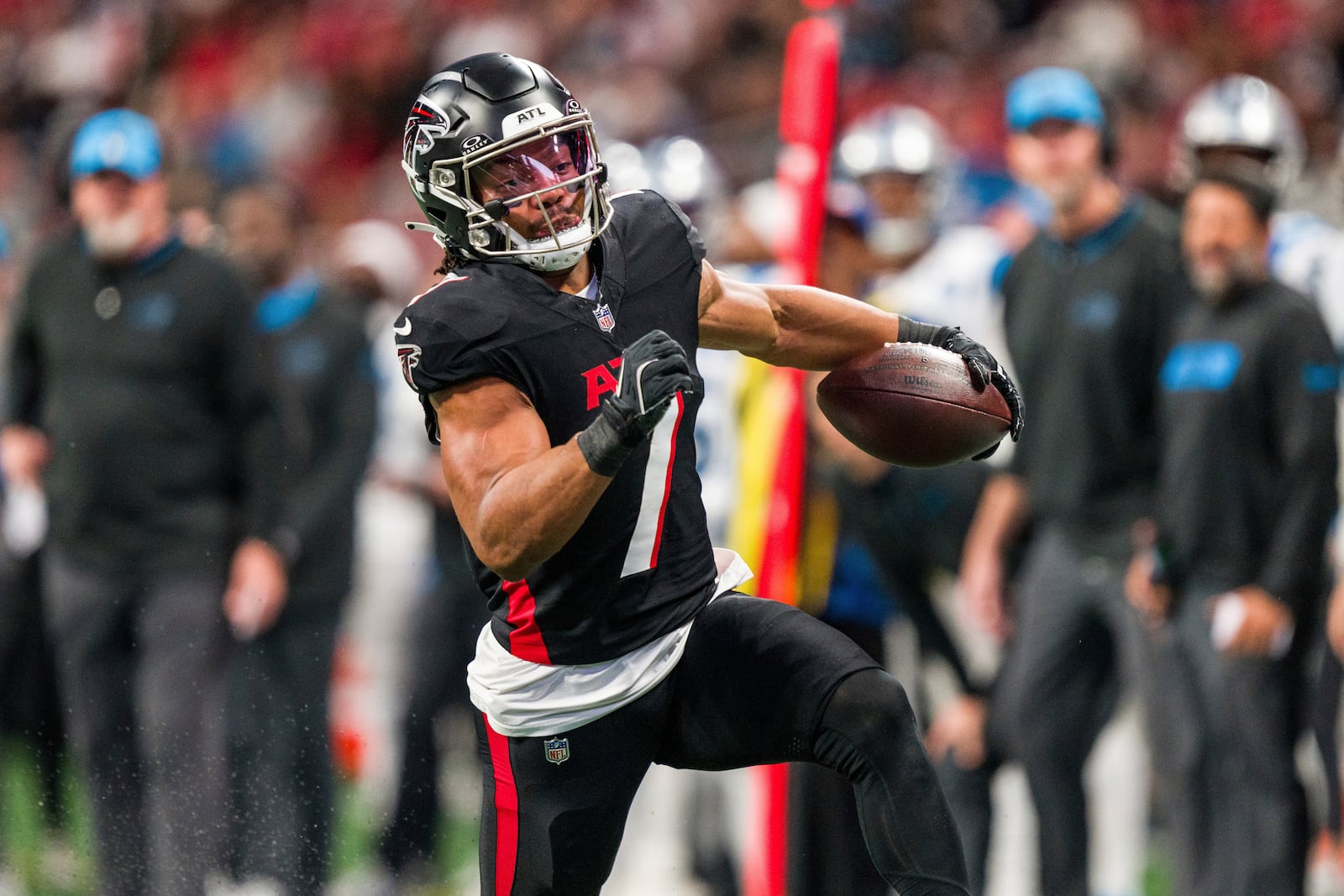 FILE - Atlanta Falcons running back Bijan Robinson (7) runs the ball during the first half of an NFL football game against the Carolina Panthers, Sunday, Jan. 5, 2025, in Atlanta. The Panthers defeated the Falcons 44-38. (AP Photo/Danny Karnik, File(
