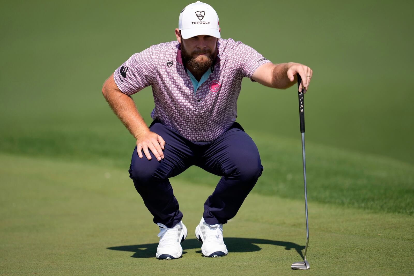 Tyrrell Hatton, of England, lines up a putt on the second hole during the first round at the Masters golf tournament, Thursday, April 10, 2025, in Augusta, Ga. (AP Photo/George Walker IV)