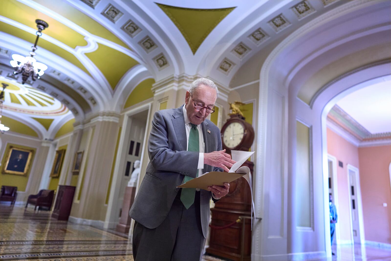 Senate Minority Leader Chuck Schumer, D-N.Y., looks over his notes as he meets with reporters at the Capitol in Washington, Tuesday, June 10, 2025. (AP Photo/J. Scott Applewhite)
