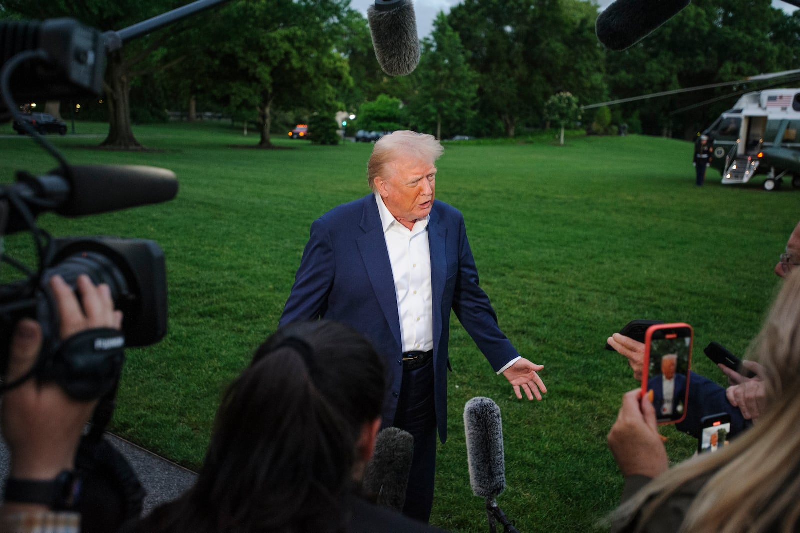 President Donald Trump speaks with reporters after disembarking Marine One upon arrival on the South Lawn of the White House in Washington, Sunday, May 4, 2025. (AP Photo/Rod Lamkey, Jr.)