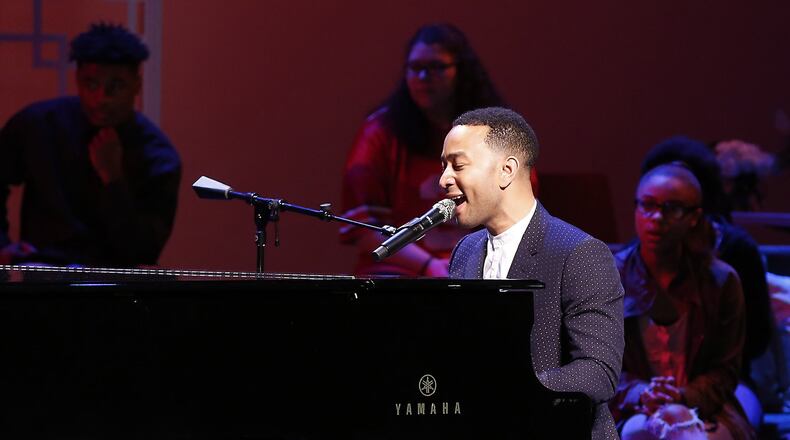 John Legend performs on stage during a concert following the ribbon cutting for the new John Legend Theater Sunday. Bill Lackey/Staff