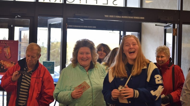 McKenzie Johnson of Miamisburg got a $100 off $100 coupon Thursday at JCPenney’s opening.