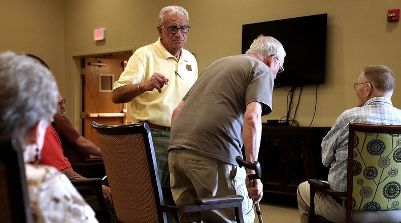 Physical Therapist Bob Kann works with parkinsons patients at Vancrest in Urbana. BILL LACKEY/STAFF
