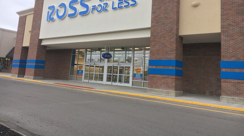 A large hiring sign and other “Coming Soon” signs are posted outside the Ross Dress For Less store in Beavercreek. STAFF PHOTO / HOLLY SHIVELY