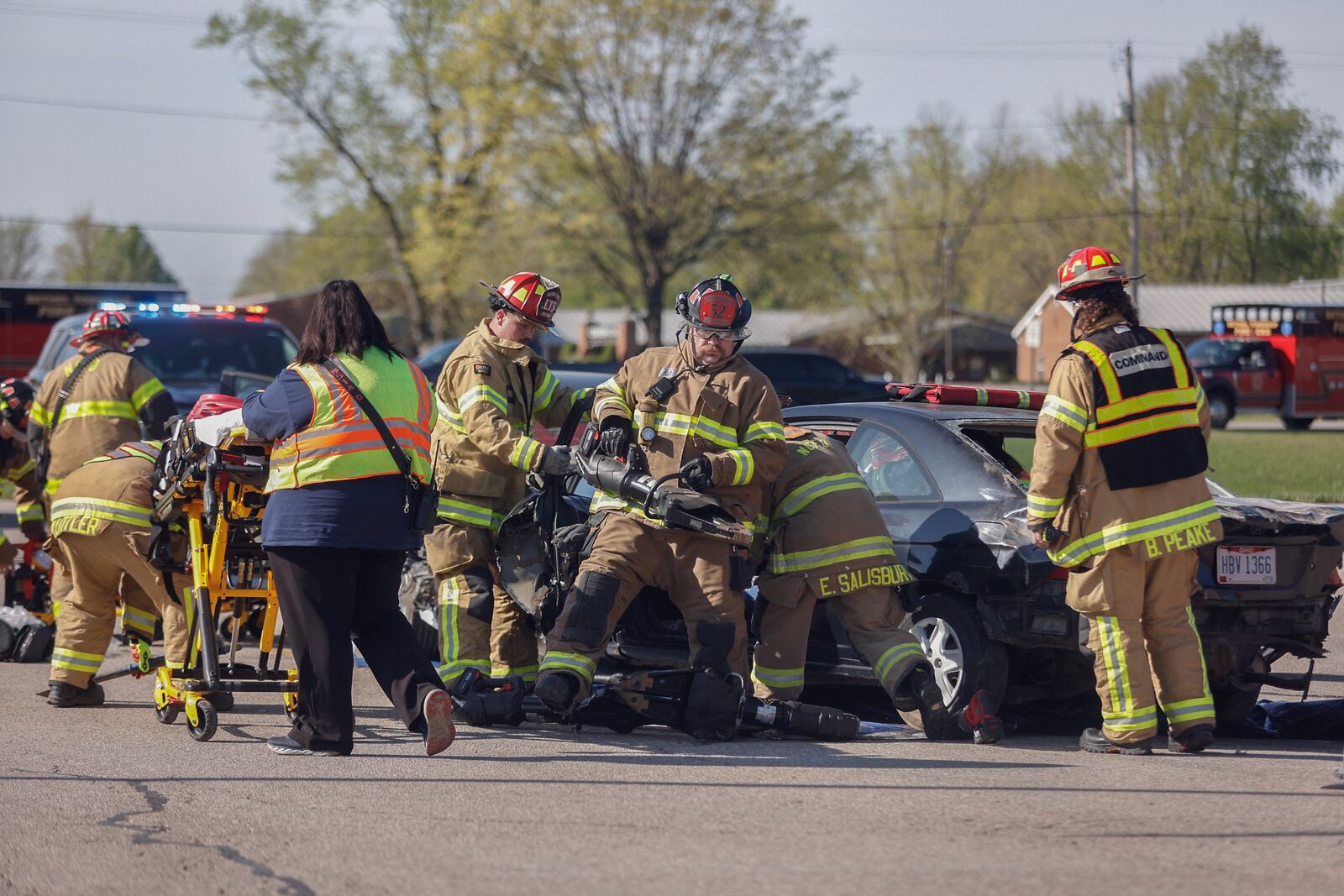 Authorities respond to the scene of a mock crash on Wednesday, April 23, 2025, at Tecumseh High School. The mock crash simulation was held to help prevent impaired and distracted driving. JOSEPH COOKE/STAFF


