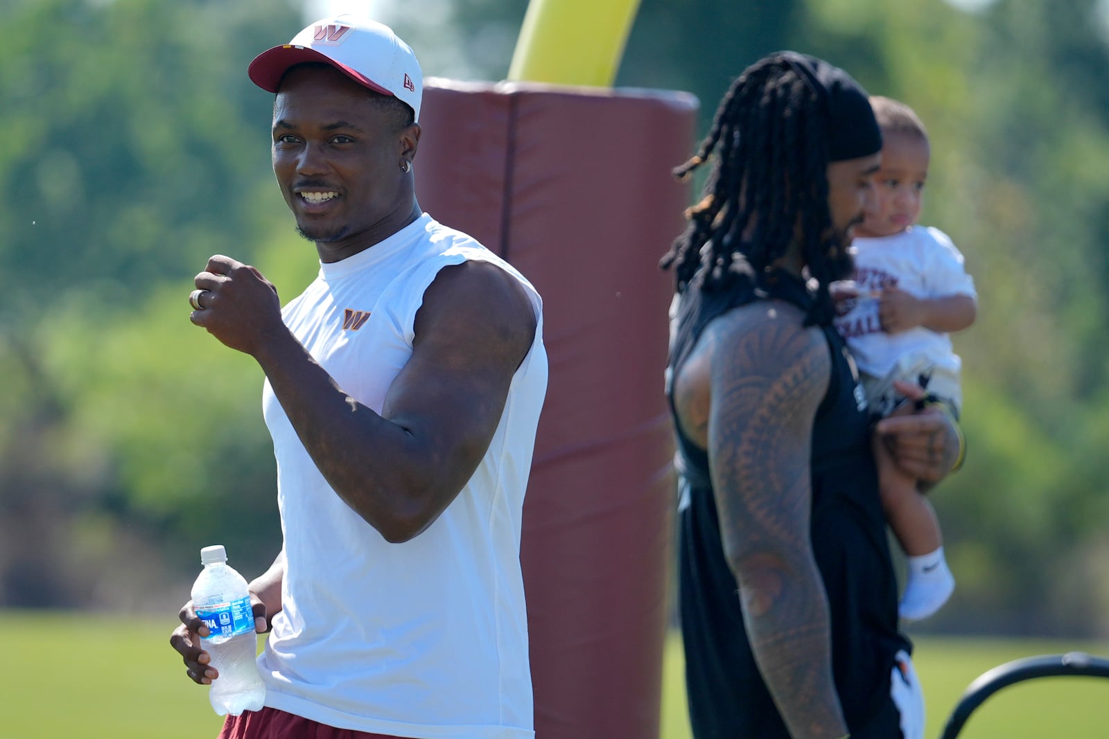 Washington Commanders wide receiver Terry McLaurin walks across the field after a practice at the team's NFL football training camp, Sunday, July 27, 2025, in Ashburn, Va. (AP Photo/Mark Schiefelbein)