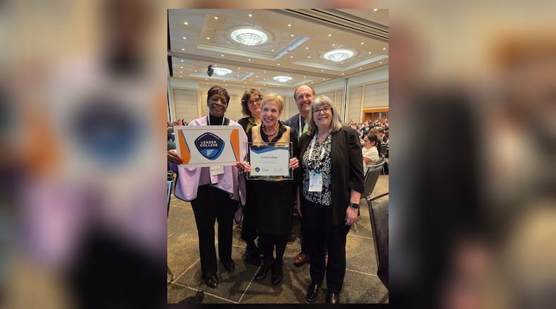 Clark State College accepts Leader College honors from Achieving the Dream during the DREAM Conference. Left to right: Sharon Evans, Clark State Board of Trustee chairperson; Amy Sues, assistant vice president institutional effectiveness; Jo Alice Blondin, Ph.D., Clark State president; Dawayne Kirkman, Ph.D., senior vice president; Adrienne Forgette, Ph.D., provost and vice president of academic affairs. CLARK STATE COLLEGE / CONTRIBUTED