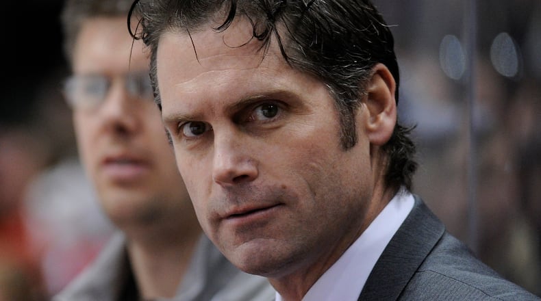 ST PAUL, MN - MARCH 22: Head coach Steve Rohlik of the Ohio State Buckeyes looks on during the first period of the Big Ten Men's Ice Hockey Championship game against the Wisconsin Badgers on March 22, 2014 at Xcel Energy Center in St Paul, Minnesota. The Wisconsin Badgers defeated the Ohio State Buckeyes 5-4 in overtime. (Photo by Hannah Foslien/Getty Images)