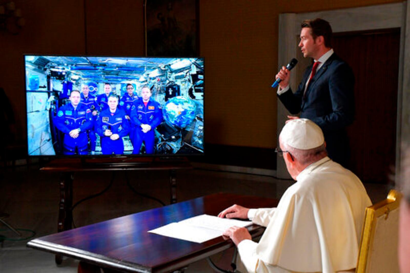 FILE - Pope Francis connects to the crew aboard the International Space Station from the Vatican, Thursday, Oct. 26, 2017. (L'Osservatore Romano/Pool Photo via AP, File)
