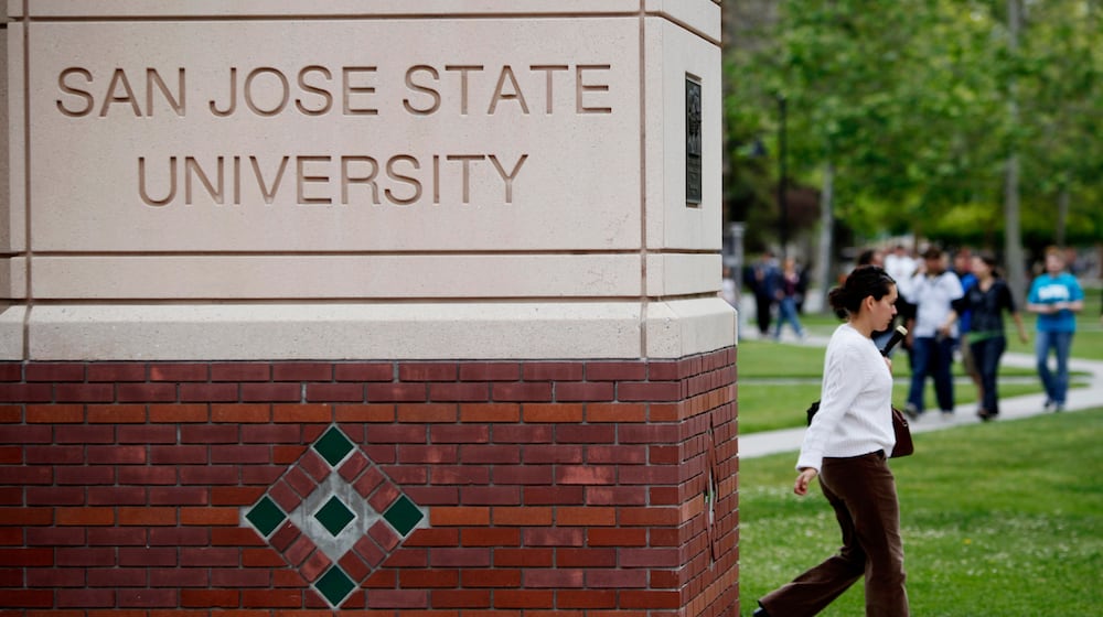 FILE - People walk on the campus of San Jose State University in San Jose, Calif., on May 5, 2009. (AP Photo/Paul Sakuma, File)