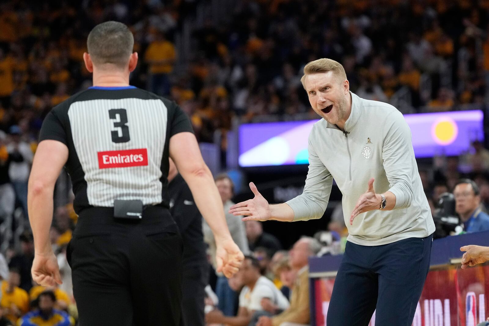 Memphis Grizzlies interim head coach Tuomas Iisalo, right, reacts toward referee Nick Buchert (3) during the second half of an NBA play-in tournament basketball game against the Golden State Warriors in San Francisco, Tuesday, April 15, 2025. (AP Photo/Jeff Chiu)