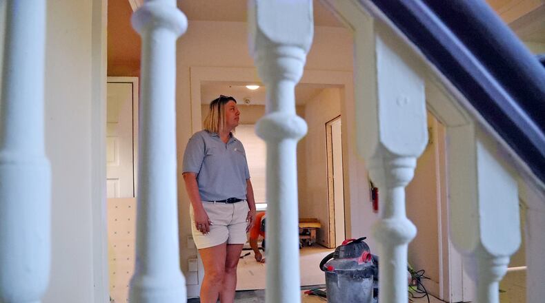 Elaina Bradley looks over the renovations going on inside Sheltered Inc. Friday, July 1, 2022. BILL LACKEY/STAFF