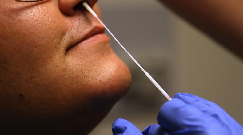 A nazel swap is used for the Covid-19 test at the Rocking Horse Center. BILL LACKEY/STAFF