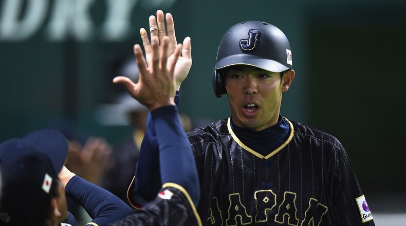 Outfielder Shogo Akiyama celebrates after scoring a run after the single by Yoshitomo Tsutsugoh in the top of the sixth inning during the SAMURAI JAPAN Send-off Friendly Match between CPBL Selected Team and Japan at the Yafuoku Dome on March 1, 2017 in Fukuoka, Japan. (Photo by Matt Roberts/Getty Images)