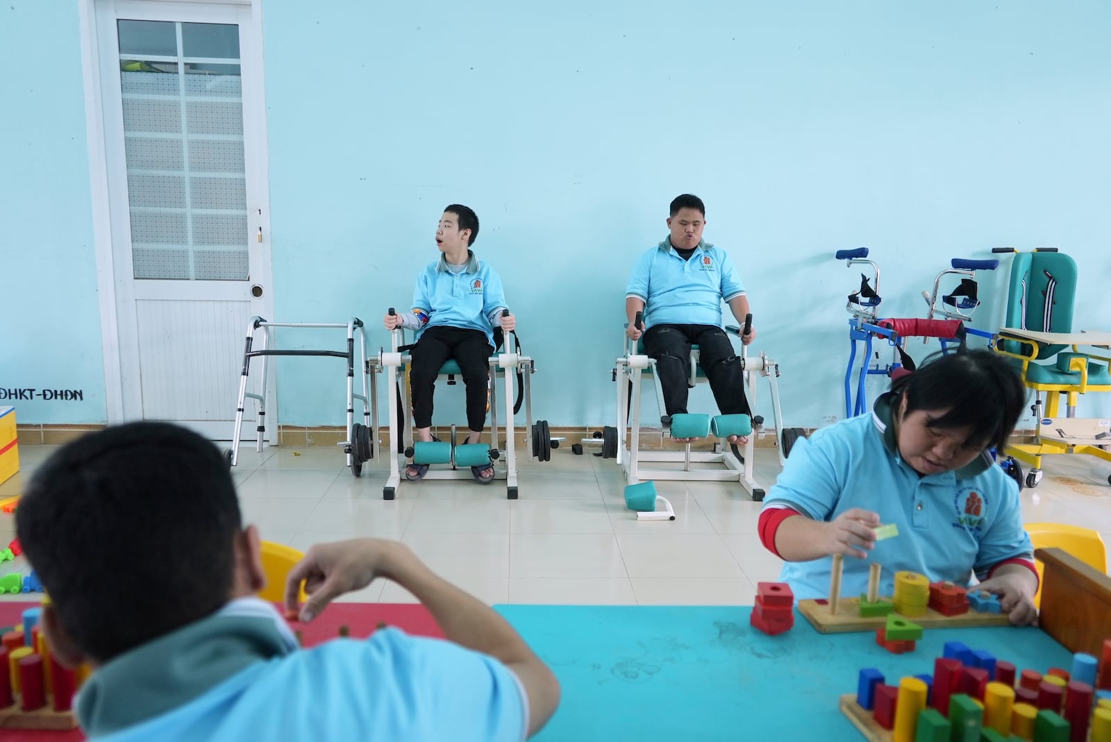 Students attend a physiotherapy class at a school for victims of Agent Orange in Da Nang, Vietnam, March 7, 2025. (AP Photo/Hau Dinh)
