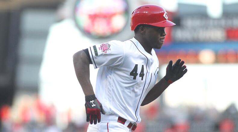 Aristides Aquino rounds the bases after a home run against the Cubs on Aug. 9, 2019, at Great American Ball Park in Cincinnati.
