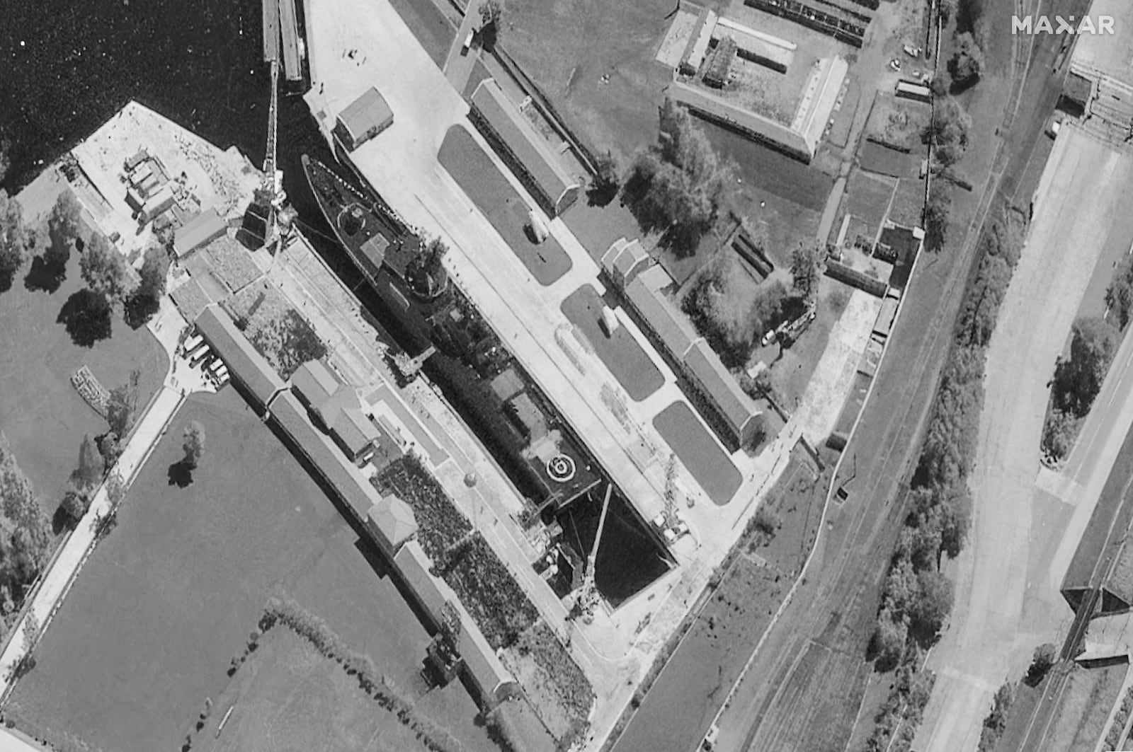 This satellite image provided by Maxar Technologies shows a North Korea's new naval destroyer, initially damaged in a failed launch ceremony at the Chongjin port on May 22, during a ceremonial relaunch at the Rajin dockyard in Najin, North Korea, Thursday, June 12, 2025. (Maxar Technologies via AP)