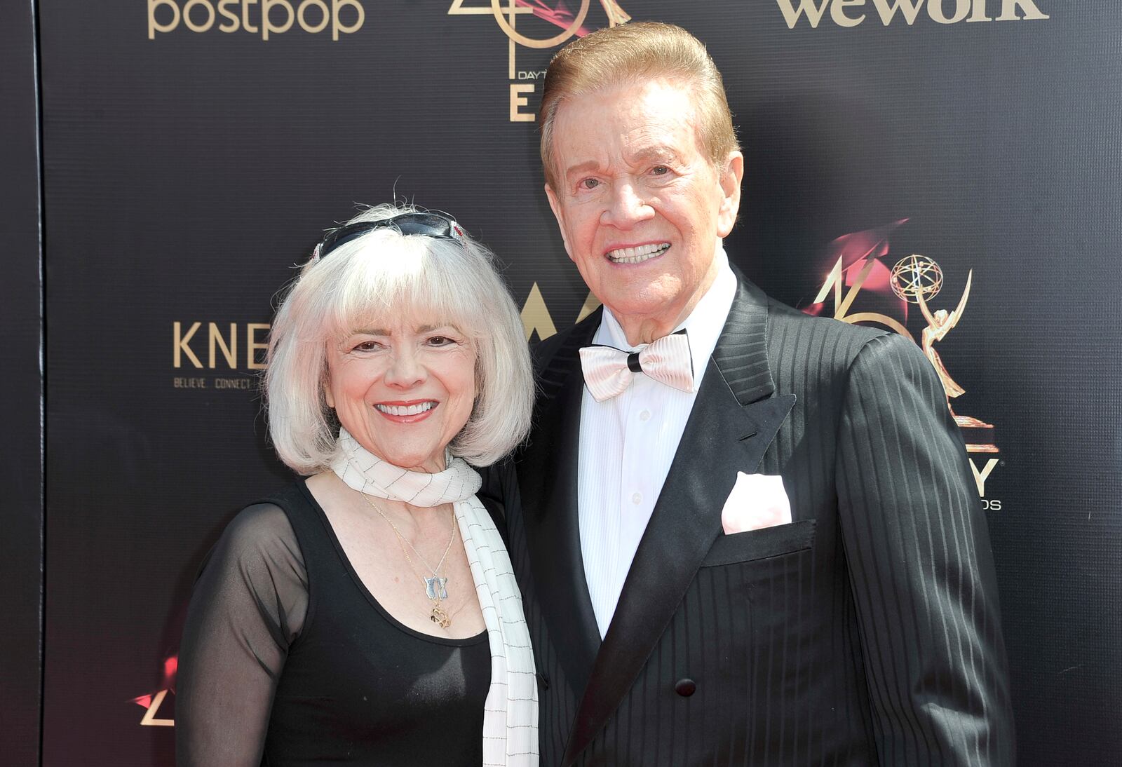 FILE - Sandy Ferra Martindale, left, and Wink Martindale arrive at the 46th annual Daytime Emmy Awards at the Pasadena Civic Center, May 5, 2019, in Pasadena, Calif. (Photo by Richard Shotwell/Invision/AP, File)
