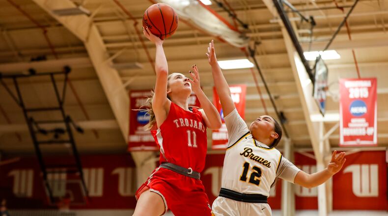 Cutline 2: Southeastern junior Brooke Nelson shoots over Shawnee's Aaliyah Perrin during their game on Thursday, Dec. 28, 2023 at the Clark County Basketball Showcase at Pam Evans Smith Arena in Springfield. Michael Cooper/CONTRIBUTED