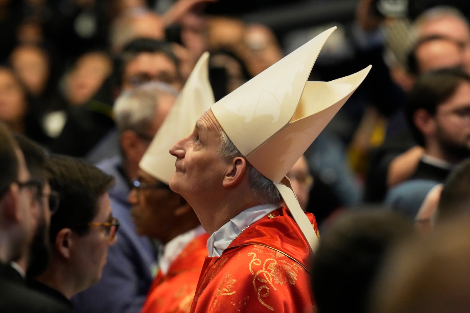 Cardinal Matteo Maria Zuppi looks up during a final Mass celebrated by cardinals inside St. Peter's Basilica, before the conclave to elect a new pope, at the Vatican, Wednesday, May 7, 2025. (AP Photo/Gregorio Borgia)