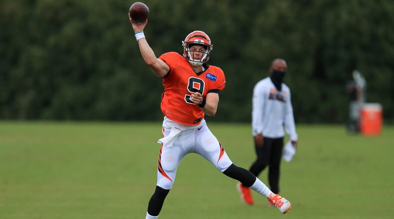 Cincinnati Bengals' Joe Burrow throws a pass during an NFL football camp practice in Cincinnati, Tuesday, Aug. 18, 2020. (AP Photo/Aaron Doster)