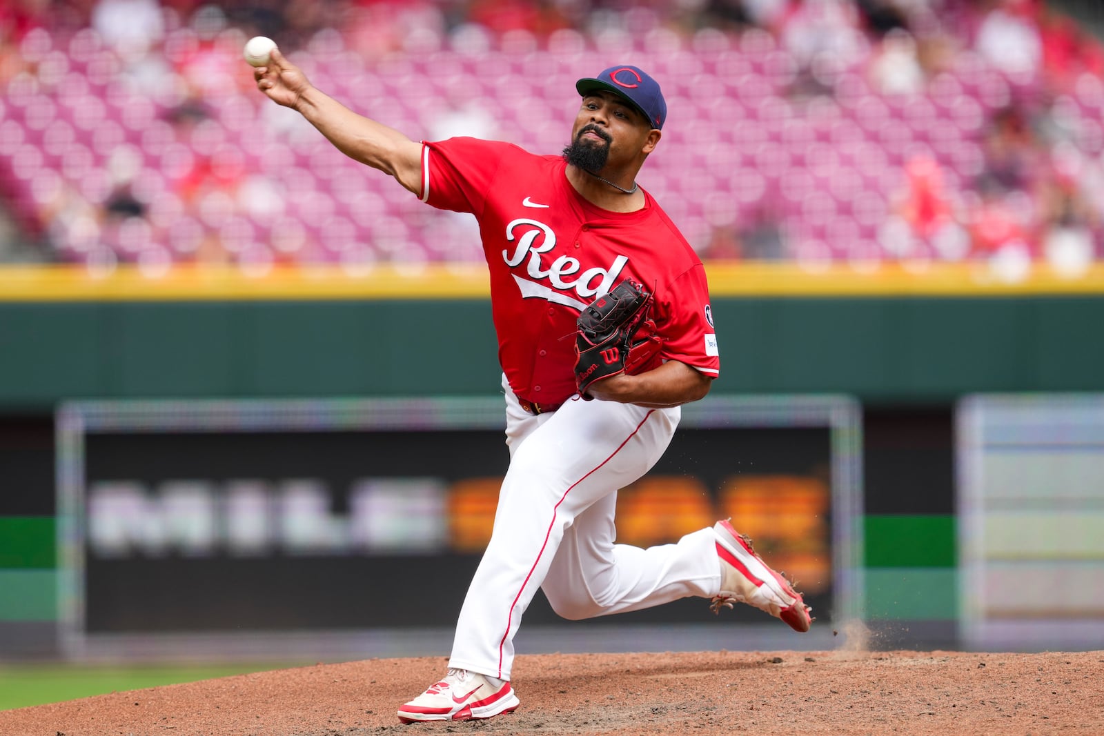 Cincinnati Reds pitcher Tony Santillan throws during the eighth inning of a baseball game against the Tampa Bay Rays, Sunday, July 27, 2025, in Cincinnati. (AP Photo/Jeff Dean)