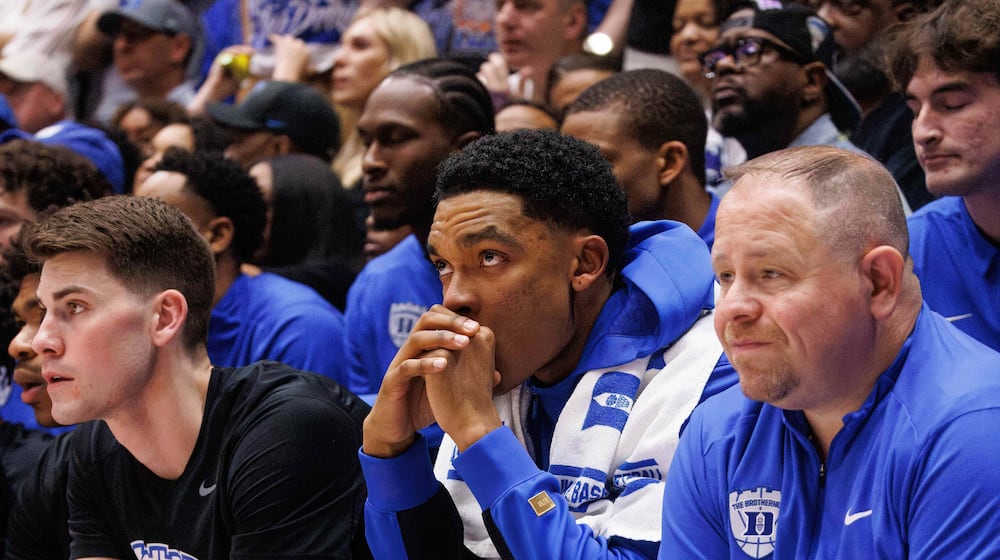 Duke's Caleb Foster sits on the bench wearing a boot after suffering an injury during the first half of an NCAA college basketball game against North Carolina in Durham, N.C., Saturday, March 7, 2026. (AP Photo/Ben McKeown)
