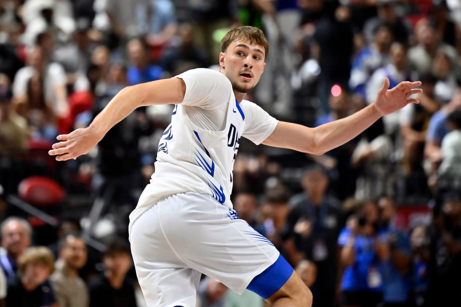 Dallas Mavericks forward Cooper Flagg (32) looks back as he runs up court against the Los Angeles Lakers during the first half of an NBA summer league basketball game Thursday, July 10, 2025, in Las Vegas. (AP Photo/David Becker)
