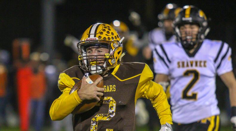 Kenton Ridge High School junior quarterback Dylan Lemen runs for a 70-yard touchdown during the first quarter of the Cougars 47-20 win over Shawnee last season. Michael Cooper/CONTRIBUTED