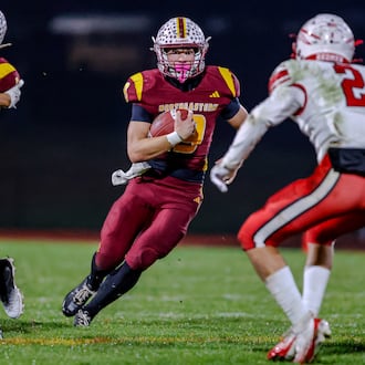 Northeastern High School senior Jacoby Newman runs the ball during their 59-0 victory over Ironton Rock Hill in a Division VI, Region 24 quarterfinal game on Friday, Nov. 7 at Conover Stadium in Springfield. MICHAEL COOPER / STAFF PHOTO