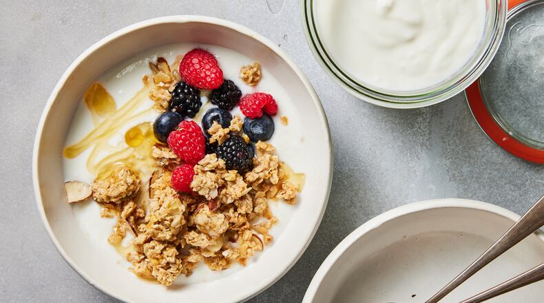 A bowl of yogurt with granola and fruit can make a good snack. Food styled by Simon Andrews. (Christopher Testani/The New York Times)