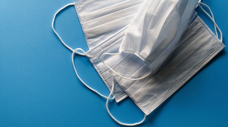 Disposable face masks are pictured. The CDC has recommended that U.S. residents use cloth face coverings in public settings to help prevent the spread of COVID-19.