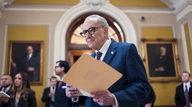 FILE—Senate Minority Leader Chuck Schumer, D-N.Y., waits to speak to reporters following a closed-door meeting with fellow Democrats on spending legislation that funds the Department of Homeland Security and a swath of other government agencies as the country reels from the deaths of two people at the hands of federal agents in Minneapolis, at the Capitol in Washington, Wednesday, Jan. 28, 2026. (AP Photo/J. Scott Applewhite, File)