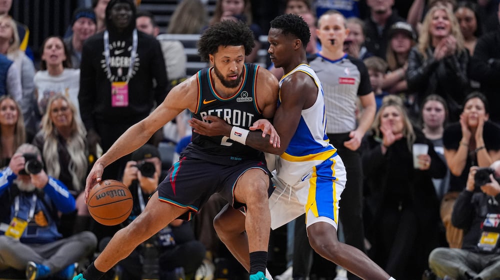 Detroit Pistons guard Cade Cunningham (2) drives on Indiana Pacers guard Bennedict Mathurin (00) during the second half of an NBA basketball game in Indianapolis, Monday, Nov. 24, 2025. (AP Photo/Michael Conroy)