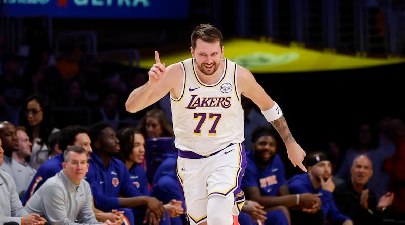 Los Angeles Lakers guard Luka Doncic reacts after scoring during the second half of an NBA basketball game against the New York Knicks, Sunday, March 8, 2026, in Los Angeles. (AP Photo/Caroline Brehman)