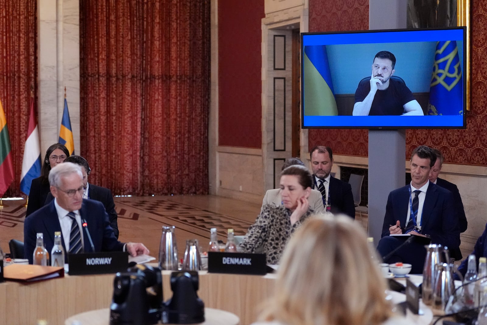 Ukrainian President of Ukraine Volodymyr Zelenskyy listens to Norway's Prime Minister Jonas Gahr Støre, as he joins Europe leaders via video link, during a meeting of the Joint Expeditionary Force (JEF) in Oslo, Friday, May 9, 2025. (Lise Åserud/NTB Scanpix via AP)