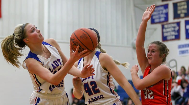 Greeneview High School junior Sylvie Sonneman shoots as Cedarville sophomore Elly Coe attempts to block it during their game at Jamestown in December. The Rams won 44-39 in overtime. CONTRIBUTED PHOTO BY MICHAEL COOPER