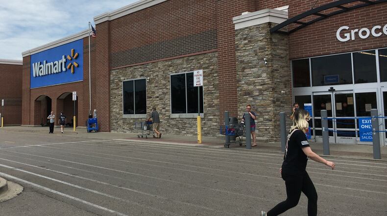 Walmart's new mask policy when into effect on Monday. Shoppers are required to wear a mask while in the store. STAFF/BONNIE MEIBERS