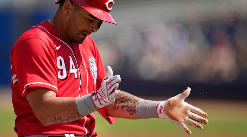 Cincinnati Reds' Christian Encarnacion-Strand celebrates after hitting a triple during the third inning of a spring training baseball game against the San Diego Padres, Wednesday, March 8, 2023, in Peoria, Ariz. Encarnacion-Strand is one of several top prospects playing in Triple-A Louisville this season. (AP Photo/Abbie Parr)