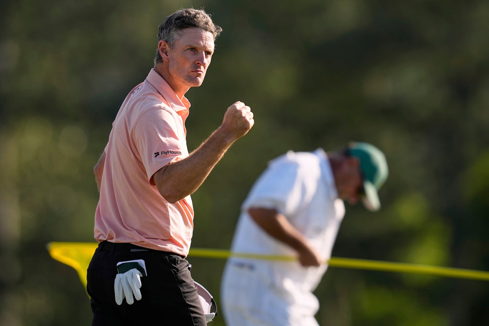 Justin Rose celebrates after a birdie on the 18th hole during the final round at the Masters golf tournament, Sunday, April 13, 2025, in Augusta, Ga. (AP Photo/David J. Phillip)