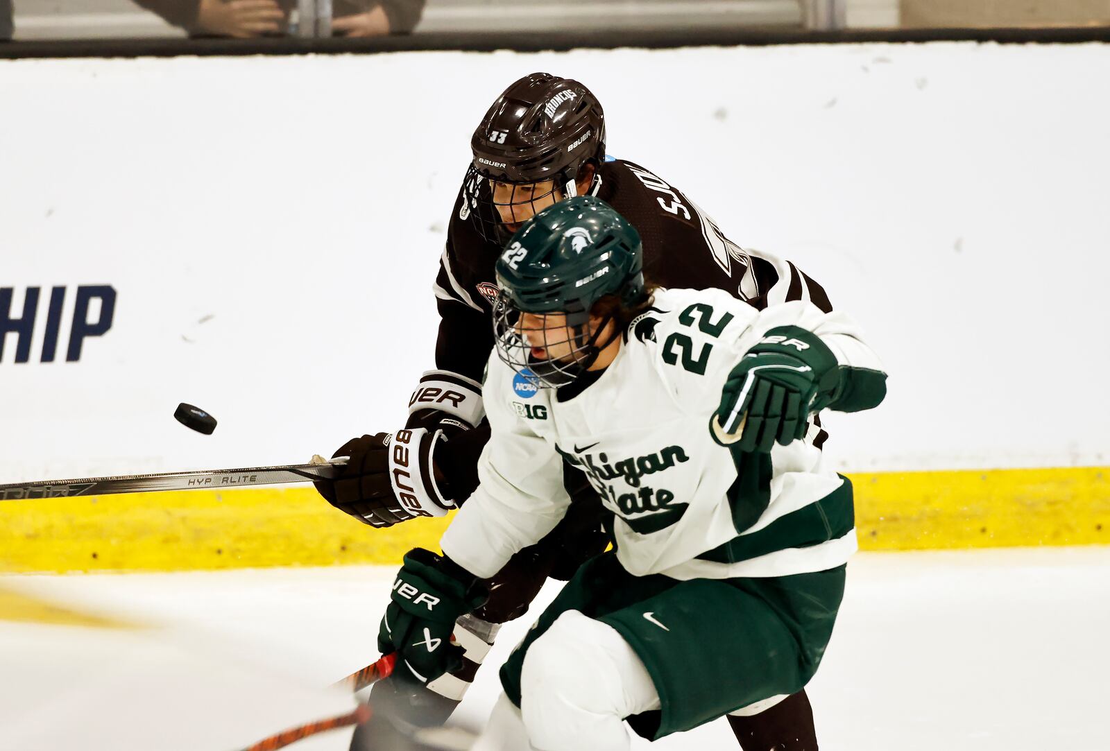 FILE - Western Michigan defenseman Samuel Sjolund, top, and Michigan State forward Isaac Howard (22) battle for the puck during the first period of an NCAA college hockey game in Maryland Heights, Mo., March 29, 2024. (AP Photo/Colin E. Braley, File)