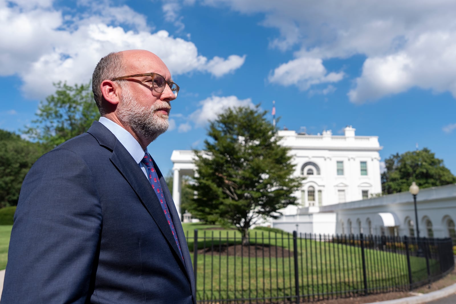 Office of Management and Budget Director Russell Vought walks at the White House, Monday, July 7, 2025, in Washington. (AP Photo/Alex Brandon)