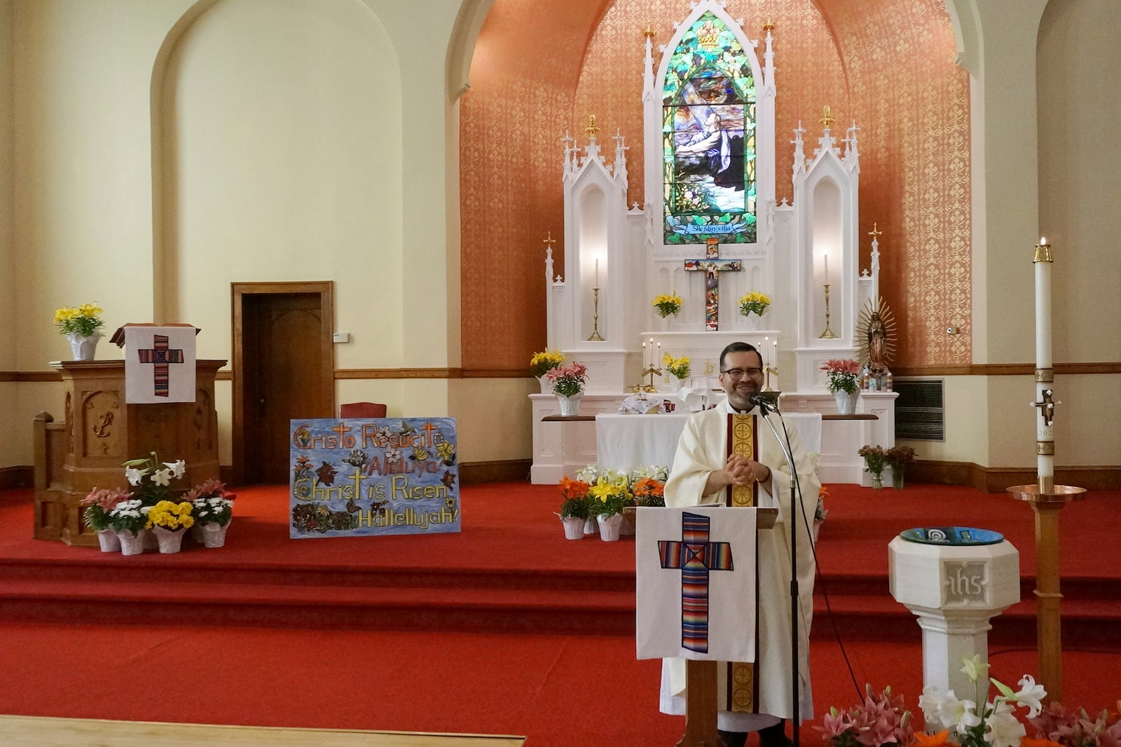 The Rev. Hierald Osorto speaks to the congregation of St. Paul’s-San Pablo Lutheran Church, which holds wellness sessions after Sunday worship in the sanctuary as part of its migrant ministry, in Minneapolis, Sunday, April 27, 2025. (AP Photo/Giovanna Dell’Orto)
