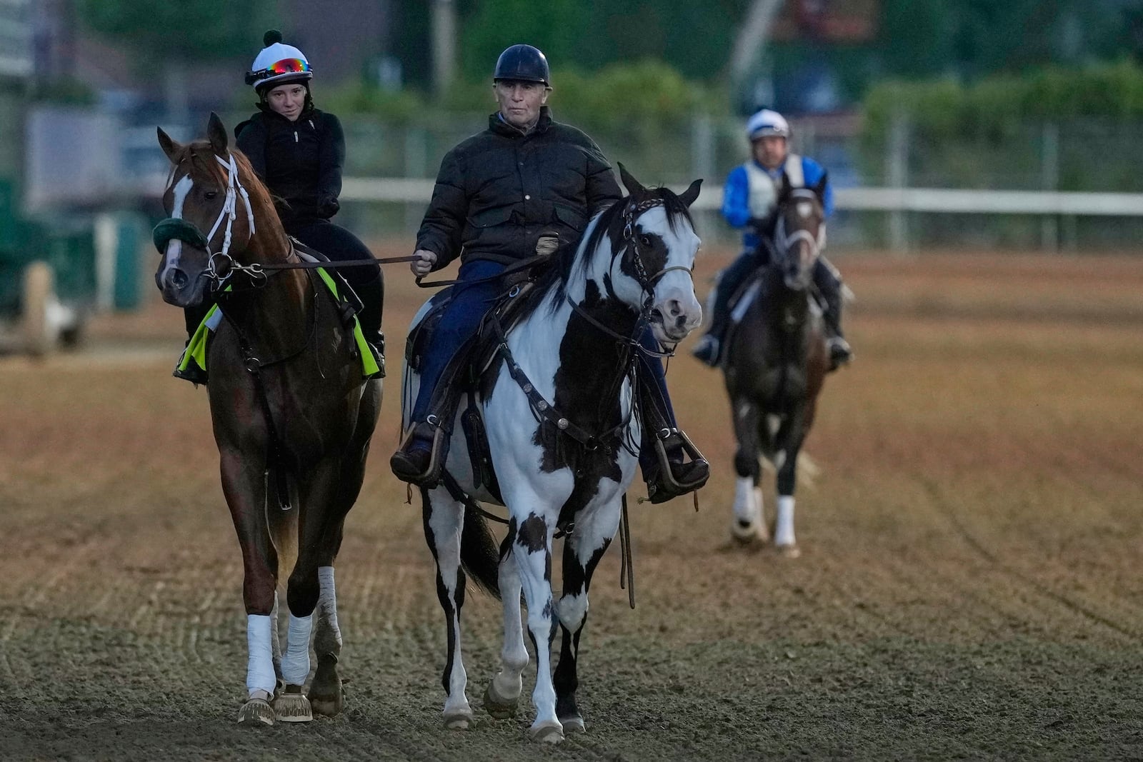 Kentucky Derby entrant American Promise is lead off the track by trainer D. Wayne Lukas after a workout at Churchill Downs Monday, April 28, 2025, in Louisville, Ky. (AP Photo/Charlie Riedel)