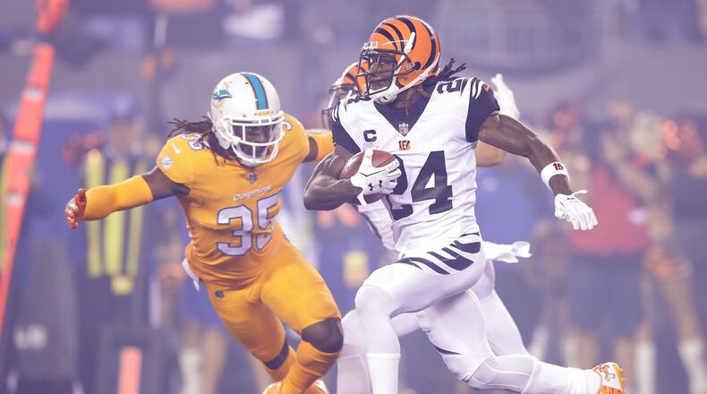 Walt Aikens of the Dolphins tries to to tackle Bengals cornerback Adam Jones during a Sept. 29, 2016 game at Paul Brown Stadium.