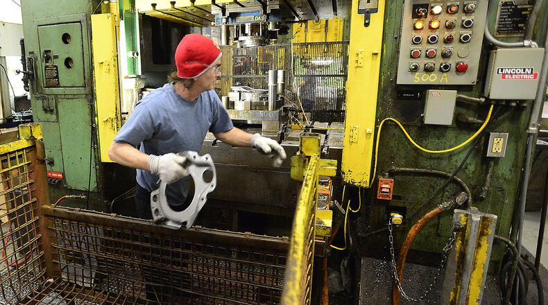 An employee works at Pentaflex, a Springfield firm that announced plans to expand its manufacturing facility in 2015. The company’s expansion was one of the largest commercial projects listed among commercial building permits in 2015 in Springfield. Staff file photo