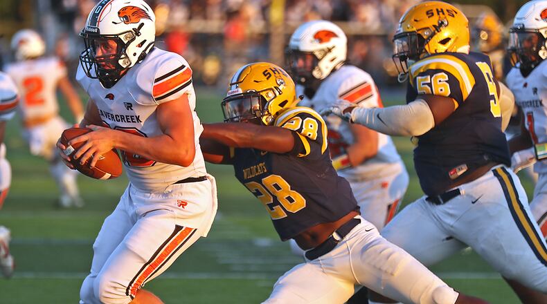 Springfield's Jaivian Norman sacks Beavercreek quarterback, Spencer Johnson.. BILL LACKEY/STAFF